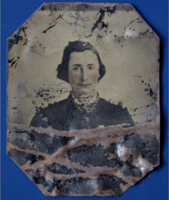 Elias Green Gore a colorized photograph of Gore with rust and defects on the image.