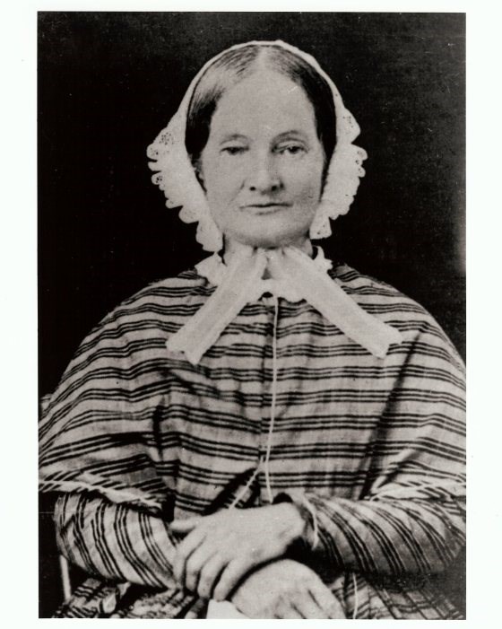 Eliza Ballou Garfield photo older woman wearing dress sitting with her hands folded in her lap