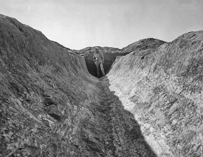 Archaeologist Emil Huray in an Hohokam ditch that he excavated in the early 1960s