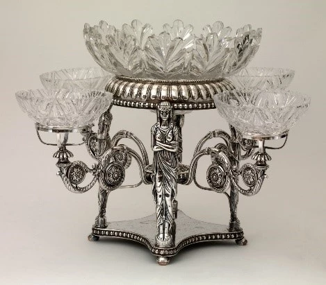 Epergne A silver Epergne with a white background.