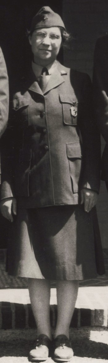 Ethel Meinzer_1942_cropped A women in a flight cap, buttoned down jacket with NPS badge pinned to her chest, dark skirt, stockings and dark shoes.