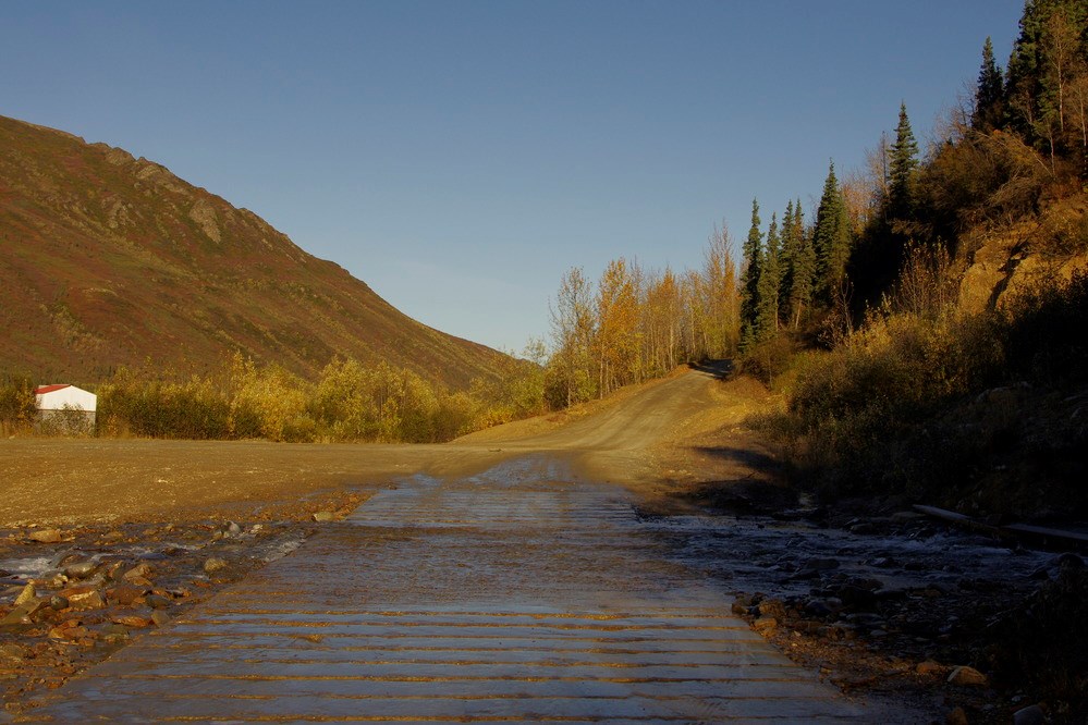 Park road crossing a creek that is flowing over it Park road crossing a creek that is flowing over it
