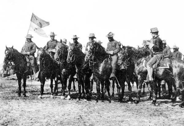 F Troop, Ninth Cavalry in the 1880s Public Domain Black and white photograph of several Buffalo Soldiers on horseback in a line. They are wearing military uniforms of the 1880s