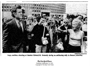 Senator Ted Kennedy at the Restore our Alienated Rights (ROAR) anti-busing protest. Senator Kennedy on the left with a crowd of people to his side.