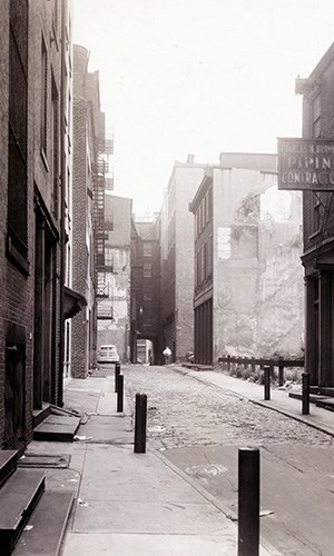 Black and white photo of Orianna Street with buildings lined on both sides.