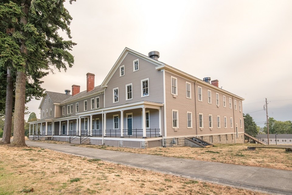 A large, 3-story double infantry barracks building at Vancouver Barracks.