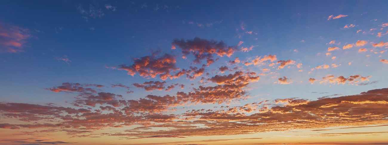 Pink clouds in a blue sky. Pink clouds in a blue sky.