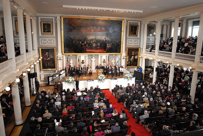 Boston Mayor Menino speaking to a packed crowd at Faneuil Hall