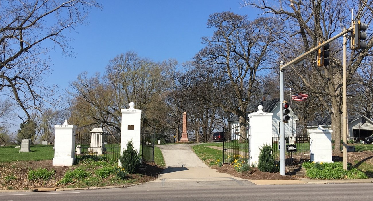 historic cemetery with graves and the text "Father Dickson Cemetery 1914."