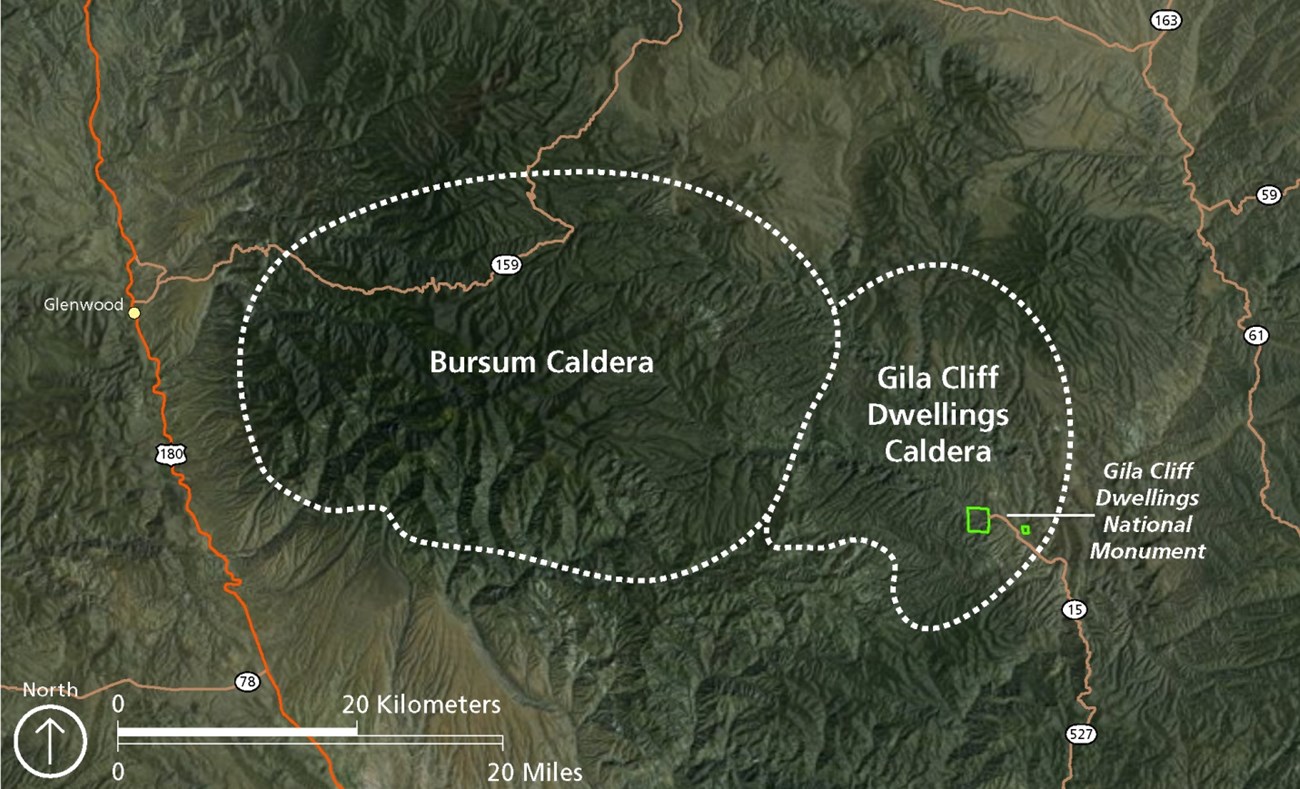 high latitude aerial image of a rugged landscape with lines added to show 2 calderas and major roads