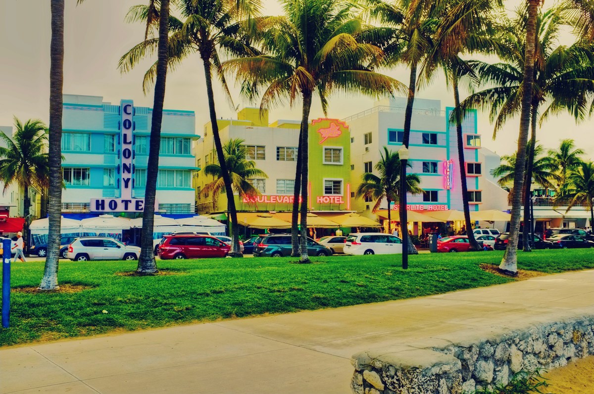 3 art deco buildings Turquoise and white Colony Hotel, Pastel yellow and white and white with turquoise trim.