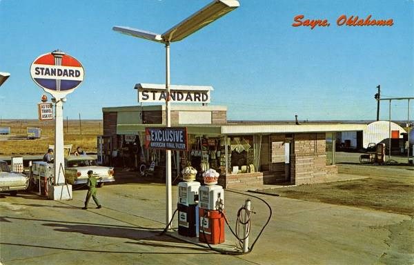Postcard Sayre, Oklahoma Gas Station with signs reading Standard