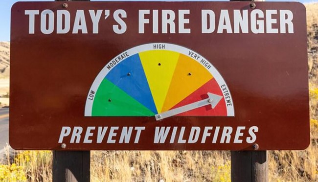 A fire danger sign with an arrow pointed to "extreme."