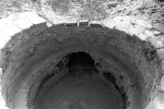 lt= round pit lined with bricks