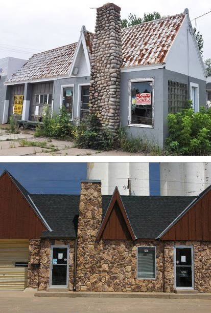 Gray brick building with a stone chimney and weathered tile roof. Stone exterior building with black roof.