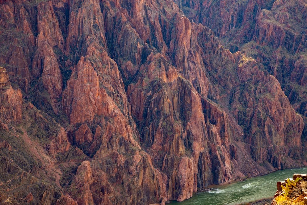 Photo of rock cliffs on a river bank.