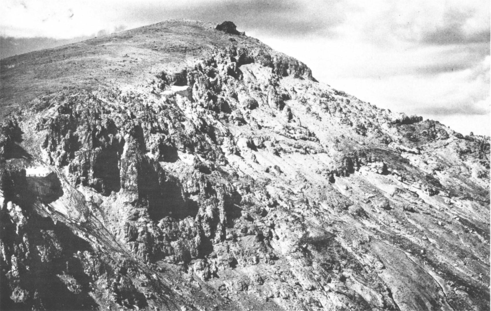 black and white photos of hillside banded cliffs