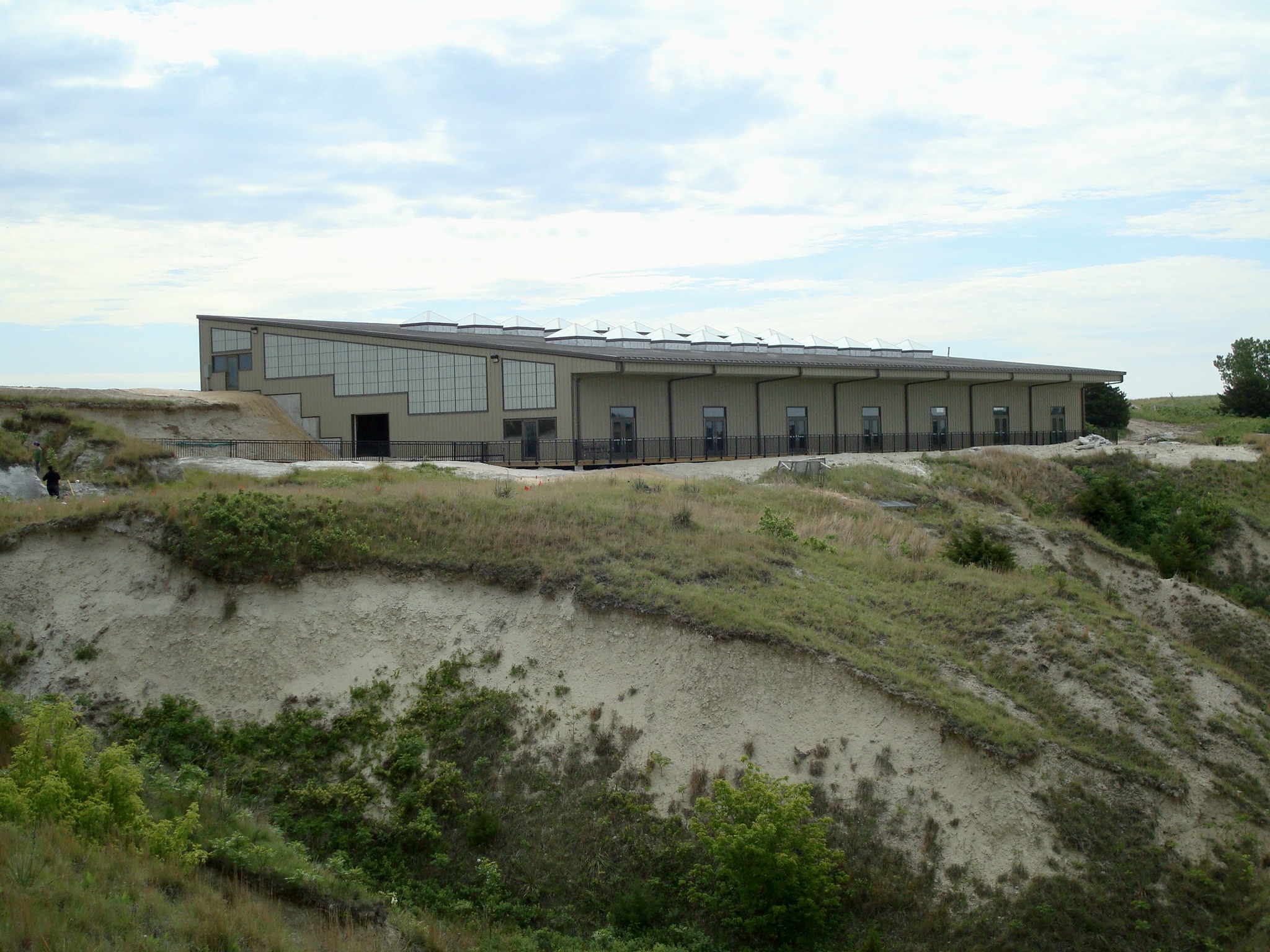 Photo of a large building atop a bluff.