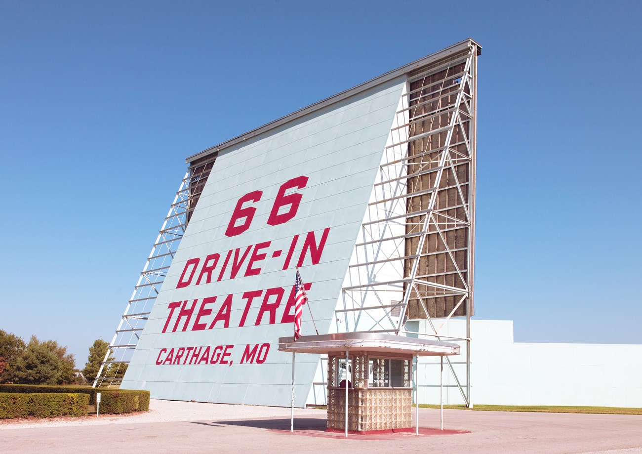 Back of large screen support with red letters reading 66 Drive-in theater, Carthage, M.O.
