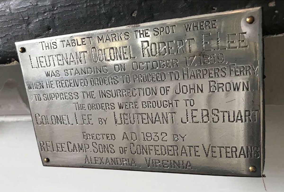 Silver plaque text reading in part “This tablet marks the spot where Lt. Col Robert E Lee Received orders Oct 17, 1859.