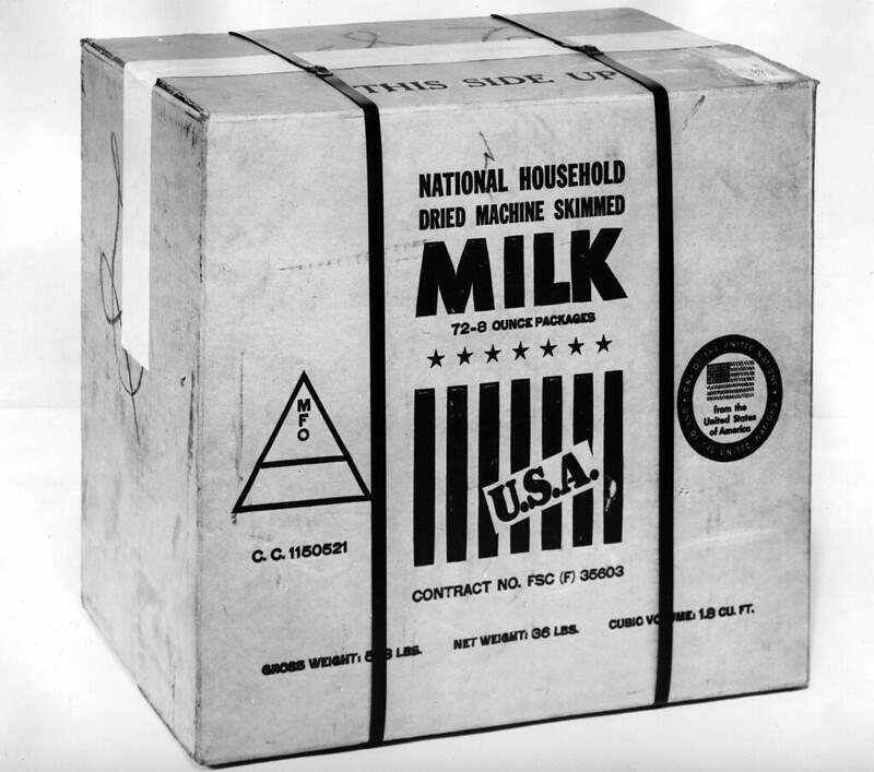 A black and white photo of a box labeled National Household Dried Machine Skimmed Milk