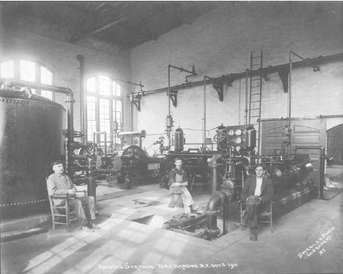 three men sit inside the Fort Hancock pumping station