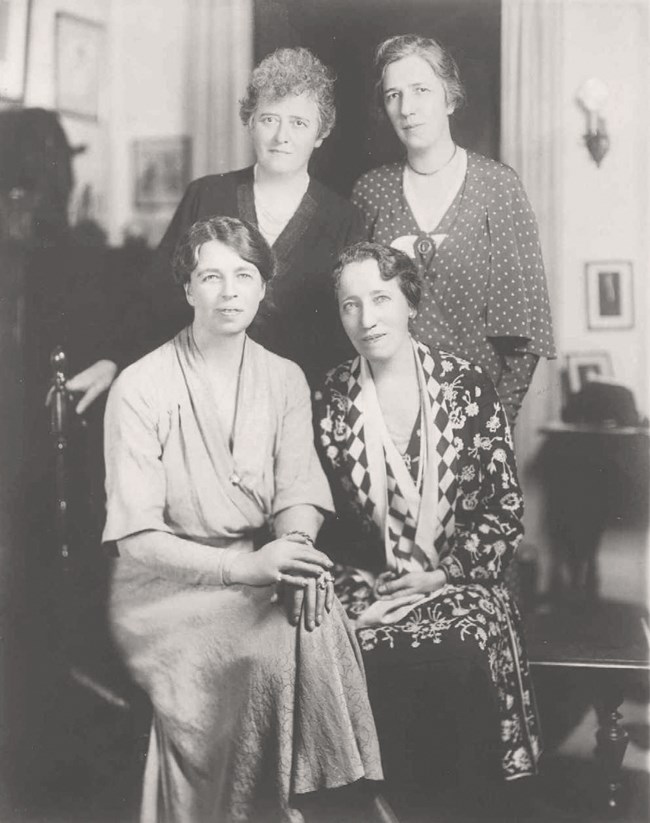 Four women in an interior.