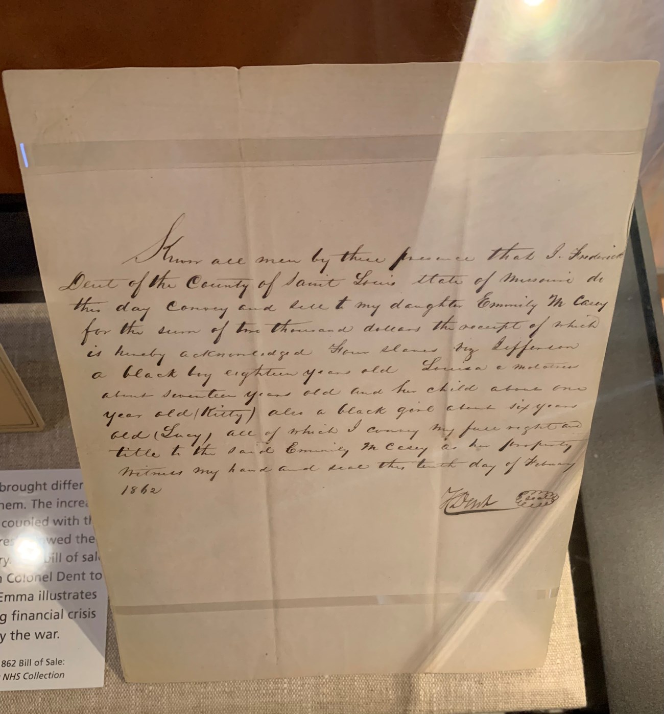 Legal paper with handwritten bill of sale transferring ownership of four enslaved people from Frederick Dent to Emily Casey.