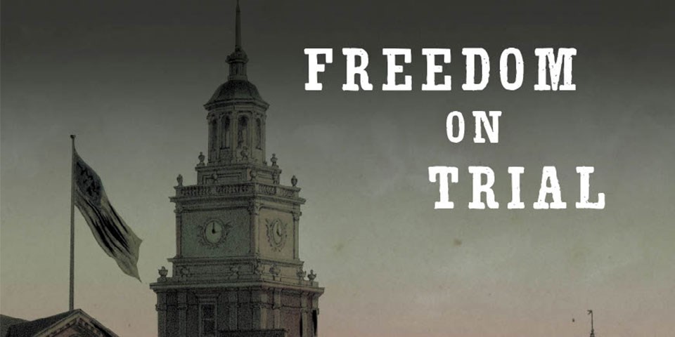 Illustration depicting the tower of Independence Hall with the words "Freedom on Trial" in bold white text.