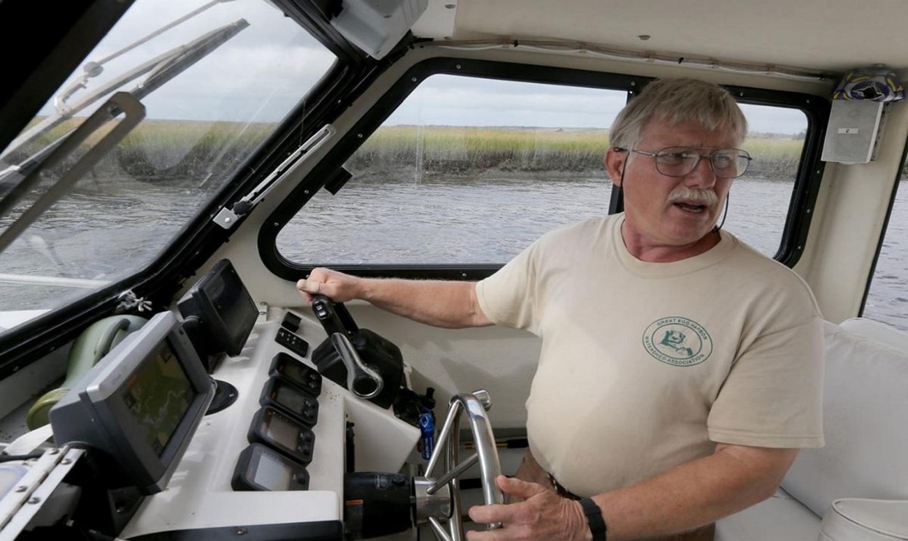 Fred Akers in one of his favorite places: on the river steering a boat. Fred is Great Egg Harbor’s Wild and Scenic River Administrator and has been a major force in getting key conservation allotments for the Great Egg. Photo by Dale Gerhard