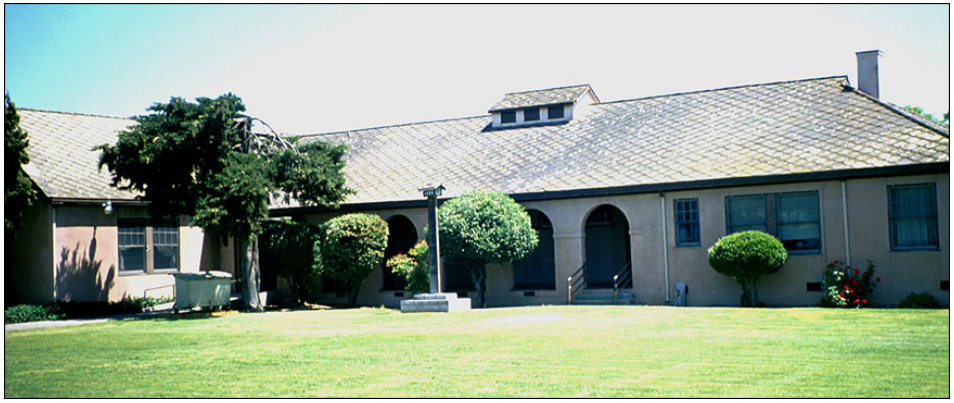 lt= A one-story building on a lawn