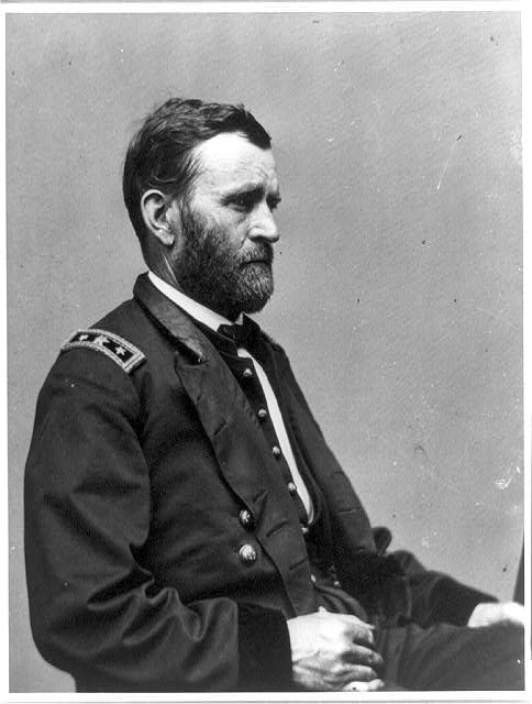 Ulysses S. Grant wearing U.S. Army uniform and sitting for photo portrait.