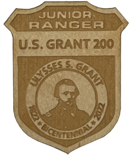 wooden badge with Grant's photo