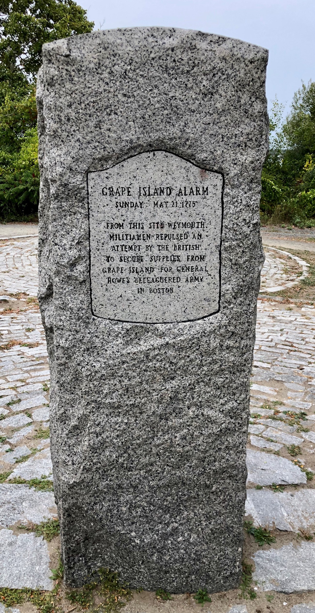 Tall stone marker recognizing the battle of Grape Island