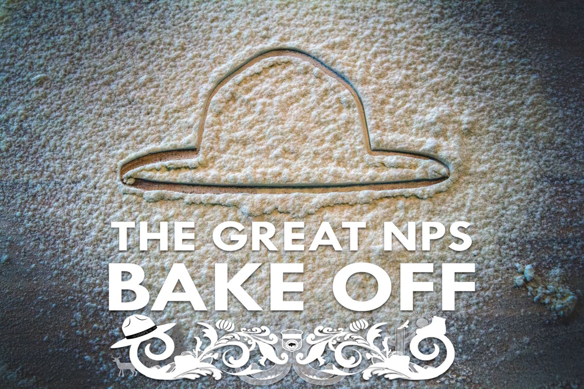 Looking down on a countertop dusted in flour a ranger hat is drawn on the surface. The bottom center reads, "The Great NPS Bake Off".