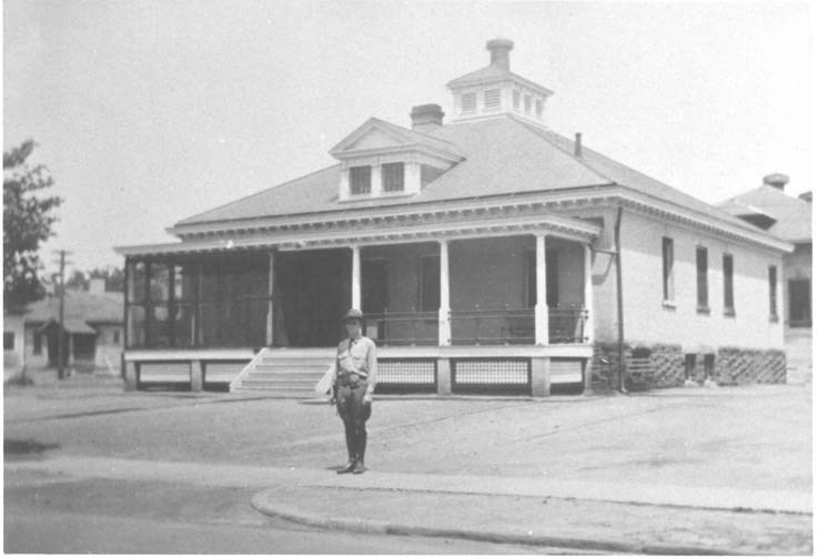 a uniformed man stands guard outdside of Building 28