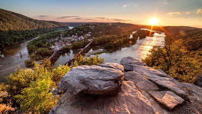 NPS/ Jason Martz View of Harpers Ferry from atop Maryland Heights as the sun sets.