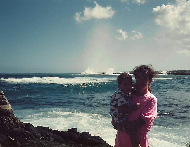 Kupaianaha eruption from 1986-1992. Mother and child standing in front of lava entering the ocean.