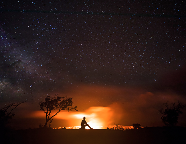 Summit eruption of Kīlauea volcano in 2008 to 2018 Silhouette of a ranger in front of a erupting volcano