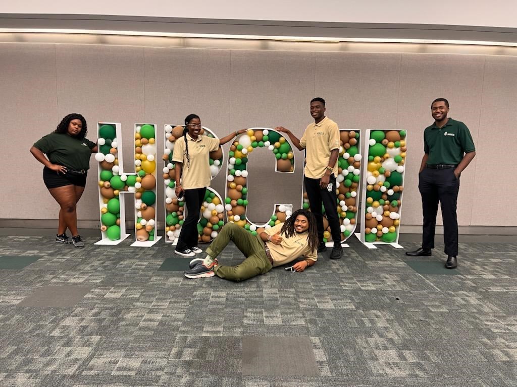 HBCUI group photo Greening Youth Foundation interns pose around large letters that spell out "HBCUI" at its annual conference