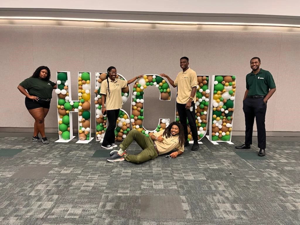 HBCUI group photo Greening Youth Foundation interns pose around large letters that spell out "HBCUI" at its annual conference