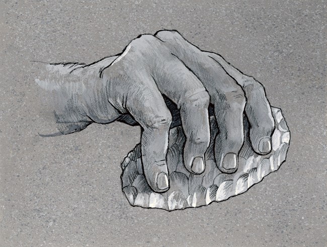 Black and white illustration of a hand holding an oval stone cutting tool.