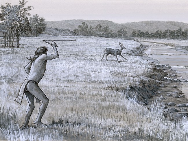 Archaic hunter Dressed in a loincloth, the man holds the atlatl above his head. At one end balances the end of the spear, forming an elbow-shape.