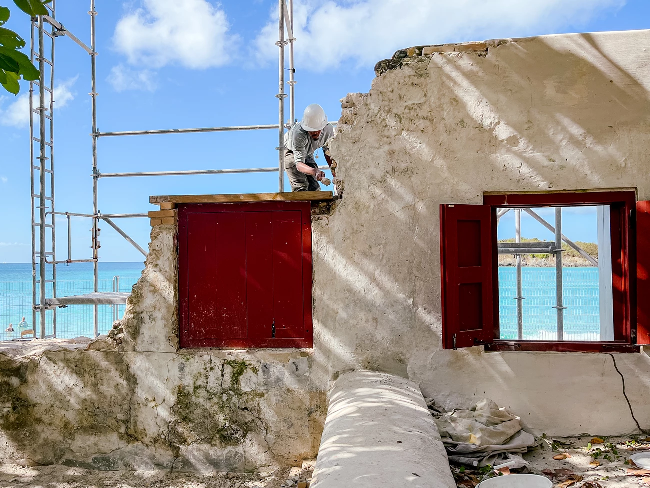 HPTC VIIS Cinnamon Bay preservation work Crew member installing a new 3”x12” lintel above a window shutter.