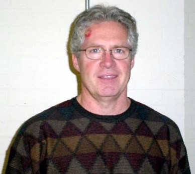 a mid-age white man in a sweater