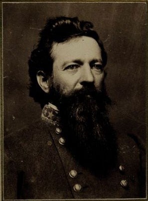Black and white photo of a man with a large beard wearing a Confederate general's uniform