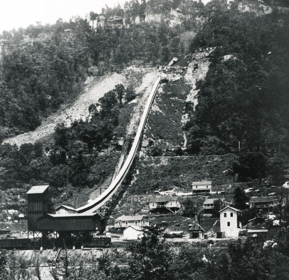 A historic photograph of a mine and mining town on a hillside