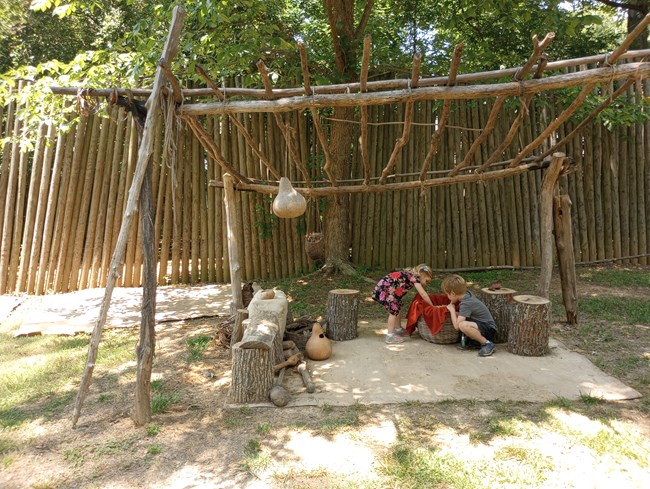 Henricus Playing with Corn Powhatan village Ana Martinez Children playing in s reproduction Indian village.