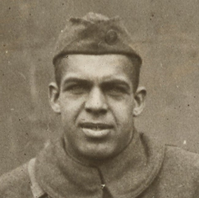 African American Man in World War One uniform looking at camera