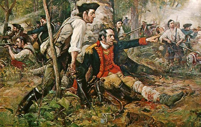 A man sits under a tree, smoking a pipe, and points to a group of soldiers. His leg is bandaged.